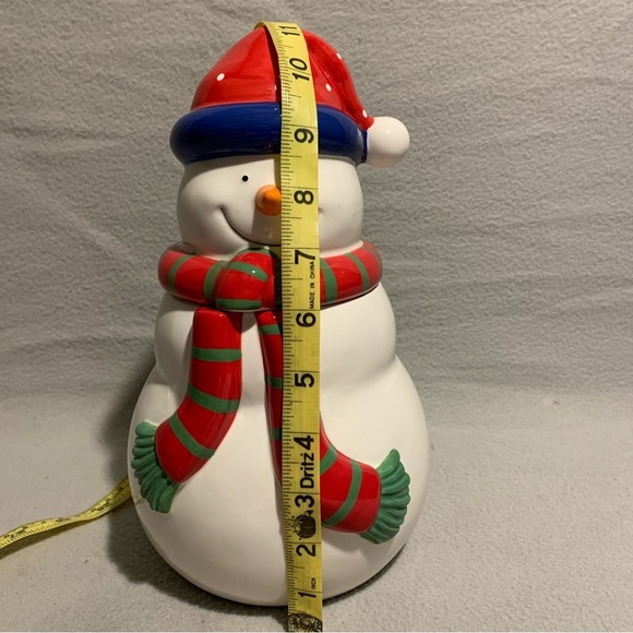 Holiday Snowman Cookie Jar with Santa’s red hat and red/green striped scarf. - Picture 2 of 8